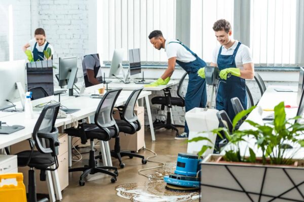 multicultural-team-of-cleaners-working-in-modern-open-space-office